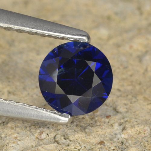 0.60ct طبيعي ازرق غامق زفير, دائري, قليلا جدا