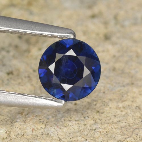 0.57ct طبيعي أزرق غامق زفير, دائري, قليلا جدا