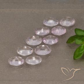 أحجار ياقوت أزرق وردى خزامى فاتح جدا طبيعية، قصة بيضاوى، قليلا جدا، وزنها 2.09 قيراط