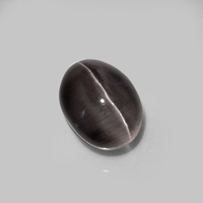 Sillimanite Cat's Eye طبيعي بلون بني رمادي، وزن ‎5.20‎ قيراط، شكل بيضاوى، مقاس ‎10.5x8.1‎ مم