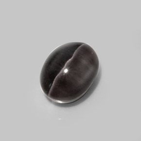 Sillimanite Cat's Eye طبيعي بلون بني رمادي، وزن ‎5.20‎ قيراط، شكل بيضاوى، مقاس ‎10.5x8.1‎ مم