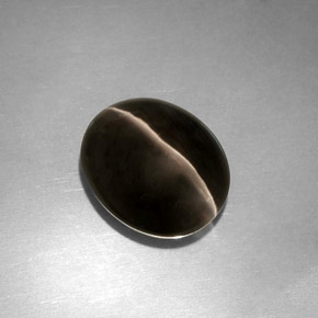 Sillimanite Cat's Eye طبيعي بلون دخاني، وزن ‎4.11‎ قيراط، شكل شفاف، مقاس ‎10.5x8.8‎ مم