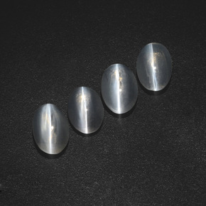 أحجار عين القط سيليمانايت دخان طبيعية، قصة بيضاوى، نصف شفاف، وزنها  قيراط