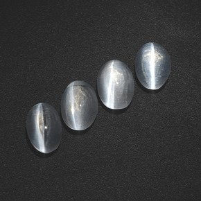 أحجار عين القط سيليمانايت دخان طبيعية، قصة بيضاوى، نصف شفاف، وزنها  قيراط