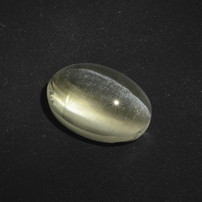Sillimanite Cat's Eye طبيعي بلون بني رمادي، وزن ‎5.56‎ قيراط، شكل بيضاوى، مقاس ‎11.8x8.1‎ مم