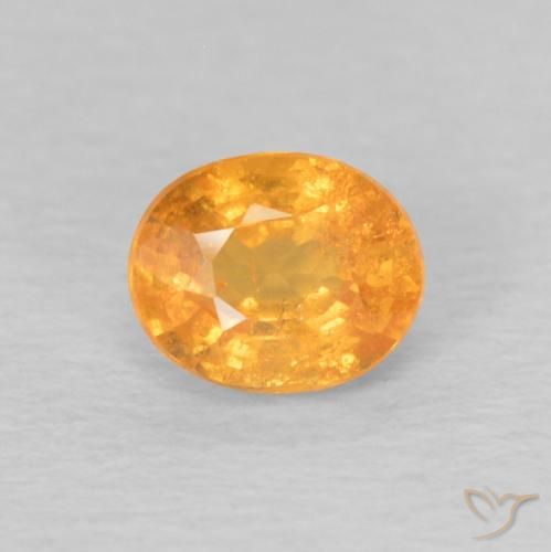 0.62ct طبيعي برتقالى كثيف غزل السبيسارتيت, بيضوي, قليلا جدا