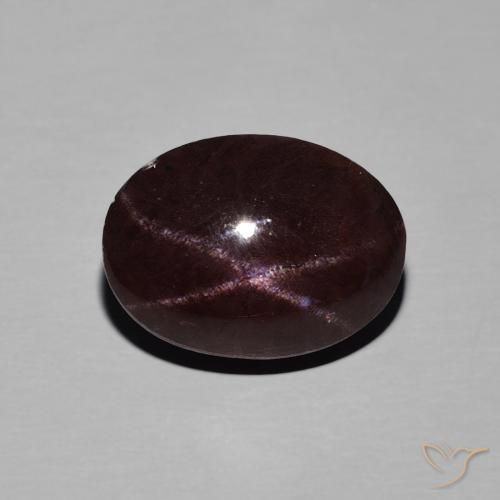 8.91ct طبيعي احمر غامق عقيق نجمى, بيضوي, غير شفاف