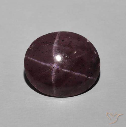 6.74ct طبيعي احمر غامق عقيق نجمى, بيضوي, غير شفاف