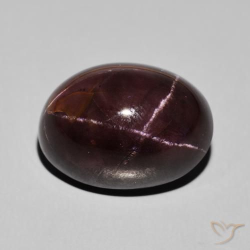 27.47ct طبيعي احمر غامق عقيق نجمى, بيضوي, غير شفاف