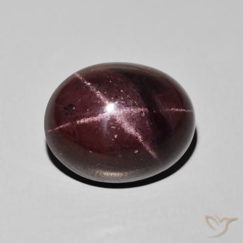27.66ct طبيعي احمر غامق عقيق نجمى, بيضوي, غير شفاف