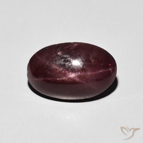 6.42ct طبيعي احمر غامق عقيق نجمى, بيضوي, غير شفاف