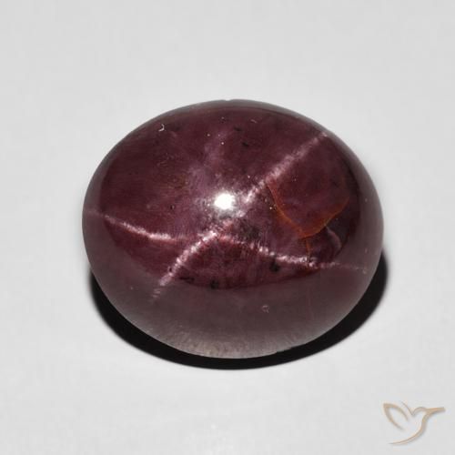 7.95ct طبيعي احمر غامق عقيق نجمى, بيضوي, غير شفاف