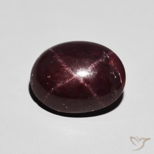 6.48ct طبيعي احمر غامق عقيق نجمى, بيضوي, غير شفاف