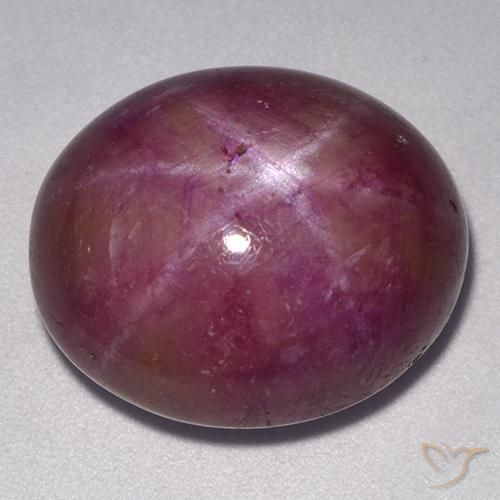 24.55ct طبيعي أرجواني محمر ياقوت نجمة, بيضوي, غير شفاف