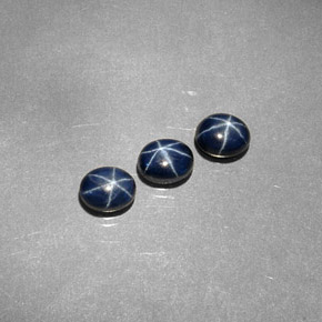 أحجار نجمة الياقوت أزرق طبيعية، قصة بيضاوى، غير شفاف، وزنها  قيراط