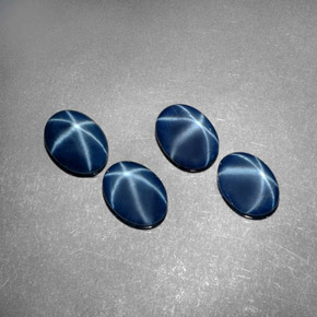 أحجار نجمة الياقوت أزرق طبيعية، قصة بيضاوى، غير شفاف، وزنها  قيراط