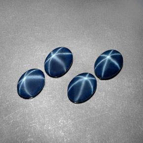 أحجار نجمة الياقوت أزرق طبيعية، قصة بيضاوى، غير شفاف، وزنها  قيراط