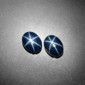 أحجار نجمة الياقوت أزرق طبيعية، قصة بيضاوى، غير شفاف، وزنها  قيراط