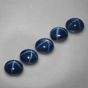 أحجار نجمة الياقوت أزرق طبيعية، قصة بيضاوى، غير شفاف، وزنها  قيراط