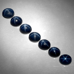 أحجار نجمة الياقوت أزرق طبيعية، قصة بيضاوى، غير شفاف، وزنها  قيراط