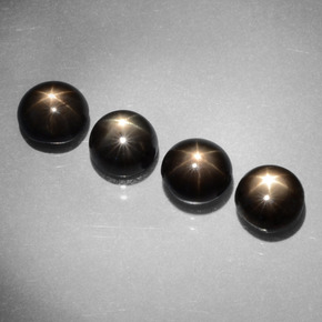 أحجار نجمة الياقوت أسود طبيعية، قصة دائرى، غير شفاف، وزنها  قيراط