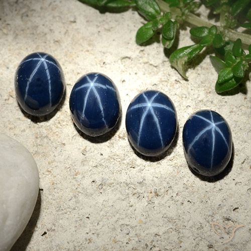 أحجار نجمة الياقوت أزرق بحرى غامق طبيعية، قصة بيضاوى، غير شفاف، وزنها 6.13 قيراط