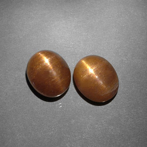 أحجار نجمة صن ستون بني ذهبي طبيعية، قصة بيضاوى، غير شفاف، وزنها  قيراط