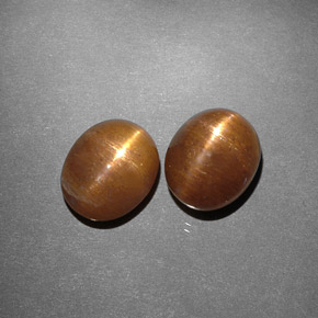 أحجار نجمة صن ستون بني ذهبي طبيعية، قصة بيضاوى، غير شفاف، وزنها  قيراط