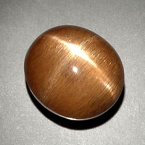 نجمة صن ستون بني ذهبي طبيعي، قصة بيضاوى، 6.93 قيراط، غير شفاف