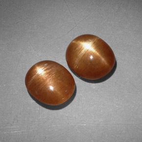 أحجار نجمة صن ستون بني ذهبي طبيعية، قصة بيضاوى، غير شفاف، وزنها  قيراط