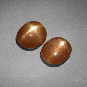 أحجار نجمة صن ستون بني ذهبي طبيعية، قصة بيضاوى، غير شفاف، وزنها  قيراط