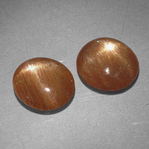 أحجار نجمة صن ستون بني ذهبي طبيعية، قصة بيضاوى، غير شفاف، وزنها  قيراط