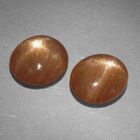 أحجار نجمة صن ستون بني ذهبي طبيعية، قصة بيضاوى، غير شفاف، وزنها  قيراط