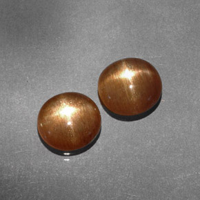 أحجار نجمة صن ستون بني ذهبي طبيعية، قصة بيضاوى، غير شفاف، وزنها  قيراط