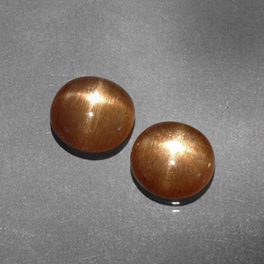 أحجار نجمة صن ستون بني ذهبي طبيعية، قصة بيضاوى، غير شفاف، وزنها  قيراط