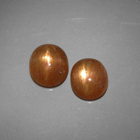 أحجار نجمة صن ستون بني ذهبي طبيعية، قصة بيضاوى، نصف شفاف، وزنها  قيراط