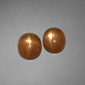 أحجار نجمة صن ستون بني ذهبي طبيعية، قصة بيضاوى، نصف شفاف، وزنها  قيراط