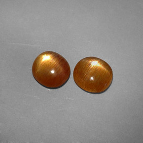 أحجار نجمة صن ستون بني ذهبي طبيعية، قصة بيضاوى، غير شفاف، وزنها  قيراط