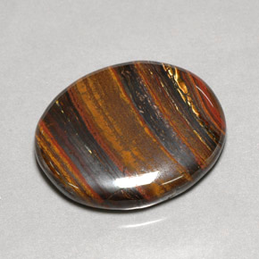 Tiger's Eye Matrix طبيعي بلون متعدد الألوان، وزن ‎53.09‎ قيراط، شكل بيضاوى، مقاس ‎31x26.7‎ مم