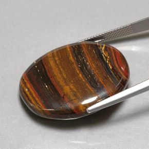 Tiger's Eye Matrix طبيعي بلون متعدد الألوان، وزن ‎53.09‎ قيراط، شكل بيضاوى، مقاس ‎31x26.7‎ مم