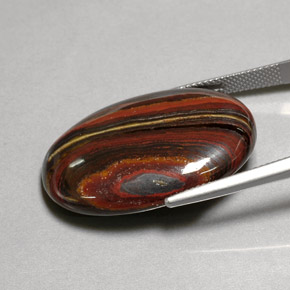 Tiger's Eye Matrix طبيعي بلون متعدد الألوان، وزن ‎45.58‎ قيراط، شكل بيضاوى، مقاس ‎30.9x21.6‎ مم