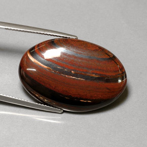 Tiger's Eye Matrix طبيعي بلون متعدد الألوان، وزن ‎35.01‎ قيراط، شكل بيضاوى، مقاس ‎29.9x20‎ مم