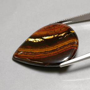 Tiger's Eye Matrix طبيعي بلون متعدد الألوان، وزن ‎37.44‎ قيراط، شكل شكل الكمثرى، مقاس ‎31x26.9‎ مم
