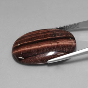 Tiger's Eye Matrix طبيعي بلون متعدد الألوان، وزن ‎42.21‎ قيراط، شكل بيضاوى، مقاس ‎34.3x22.7‎ مم