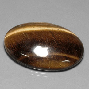 Tiger's Eye طبيعي بلون بني ذهبي، وزن ‎78.03‎ قيراط، شكل بيضاوى، مقاس ‎40.7x30.7‎ مم