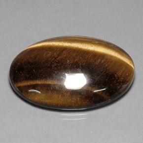 Tiger's Eye طبيعي بلون بني ذهبي، وزن ‎78.03‎ قيراط، شكل بيضاوى، مقاس ‎40.7x30.7‎ مم