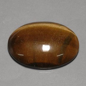 Tiger's Eye طبيعي بلون بني ذهبي، وزن ‎75.77‎ قيراط، شكل بيضاوى، مقاس ‎40x29.9‎ مم