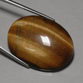 Tiger's Eye طبيعي بلون بني ذهبي، وزن ‎75.77‎ قيراط، شكل بيضاوى، مقاس ‎40x29.9‎ مم