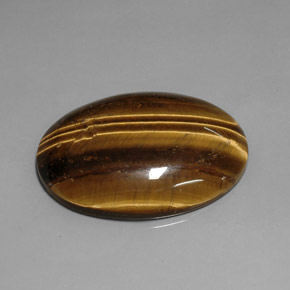Tiger's Eye طبيعي بلون بني ذهبي، وزن ‎76.92‎ قيراط، شكل بيضاوى، مقاس ‎40x29.9‎ مم