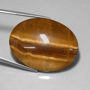 Tiger's Eye طبيعي بلون بني ذهبي، وزن ‎78.13‎ قيراط، شكل بيضاوى، مقاس ‎40x30.1‎ مم